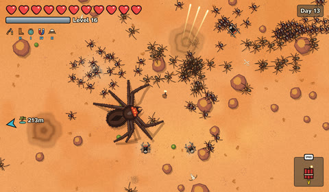 A giant spider erupts from the sand
